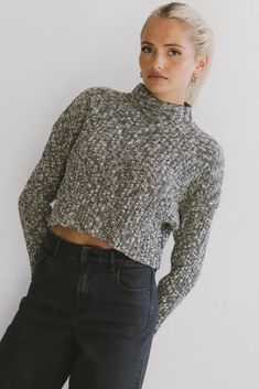 Mock neck sweater in black Knit Tops For Layering In Winter, Gray Cable Knit Top For Fall, Cozy Knitted Tops, Cozy Fit Cable Knit Tops For Winter, Cozy Fit Textured Knit Tops, Stretch Textured Knit Top For Winter, Cozy Fit Chunky Knit Crew Neck Tops, Gray Knit Top For Fall, Cozy Fit Knit Tops