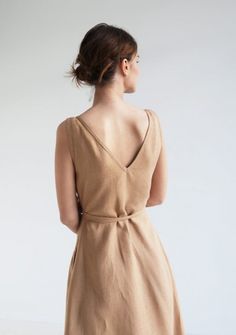 Sleeveless wrap linen dress Rosie Sleeveless Flax Linen Dress, Sleeveless Linen Dress In Flax Color, Flax Sleeveless Linen Dress, Chic Beige Sleeveless Linen Dress, Chic Beige Linen Sleeveless Dress, Fitted Knee-length Linen Wrap Dress, Elegant Beige Linen V-neck Dress, V-neck Sleeveless Linen Dress For Daywear, Linen V-neck Sleeveless Dress For Beach