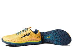 a pair of yellow and blue running shoes