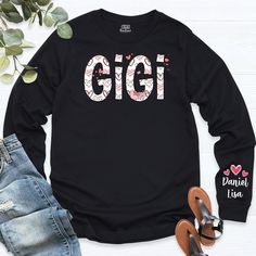 Custom Gigi Sweatshirt With Children Name On Sleeve, Personalized Grandma Long Sleeve, Kids on Sleeve Gigi Sweatshirt, Grandkids Names Tee.   Welcome to our store!  -We specialize in funny, customizable apparel shirts in different colors and styles printed on ultra-soft, super comfortable, and breathable material.  -Solid colors 50/50 Preshrunk Cotton/Polyester -We use Gildan - Heavy Blend and one of the best quality products on the market. If there are personal designs you want, we can make cus Family Matching Long Sleeve Tops For Spring, Spring Family Matching Long Sleeve Tops, Cute Name Print Tops For Fall, Cute Tops With Name Print For Fall, Long Sleeve Tops With Name Print For Fall, Long Sleeve Name Print Tops For Fall, Cute Long Sleeve T-shirt For School, Family Matching Long Sleeve Letter Print Tops, School Long Sleeve T-shirt With Name Print