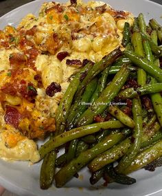 a plate with green beans and potatoes on it