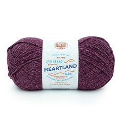 a ball of yarn with the words heartland written on it in white and purple