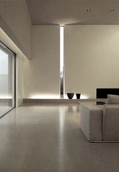 an empty living room with yellow walls and white flooring is pictured in this image