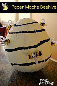 a cake shaped like a bee sitting on top of a counter