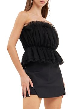 Turn up the drama with this textured tulle top featuring a strapless neckline and fabulous peplum. Strapless Lined 100% polyester Hand wash, dry flat Imported Elegant Ruffled Bandeau Tube Top, Chic Strapless Tube Top With Ruffles, Chic Strapless Ruffled Tube Top, Strapless Ruffled Tube Top For Night Out, Strapless Ruffled Tube Top For Date Night, Strapless Summer Cocktail Tops, Ruffled Bandeau Tube Top For Night Out, Strapless Ruffled Tops For Evening, Evening Strapless Tops With Ruffles