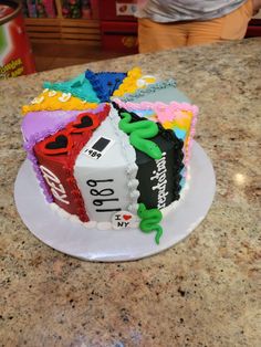 a birthday cake decorated with colorful candy bars