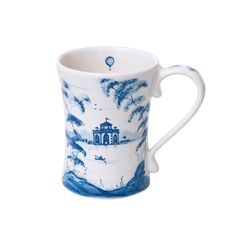 a blue and white coffee cup with an image of a house on it