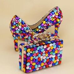 This Multicolored Luxury Rhinestone Encrusted Shoes And Purse Set is handmade and perfect for weddings. The pumps come in a variety of heel heights (6cm, 8cm, 11cm, 14cm) and feature a thin heel, split leather upper, round toe, slip-on closure, rubber outsole and insole, and a 3cm platform. The lining is PU and the fashion element is crystal. This set fits true to size. This set is perfect for any special occasion. The multicolored rhinestones add a touch of luxury and sparkle to any outfit. The Shoes And Purse, Rhinestone Wedding Shoes, Crystal Wedding Shoes, Pearl Bride, Kid Projects, Platform High Heel Shoes, Bag Women Fashion, Italian Shoes, High Shoes