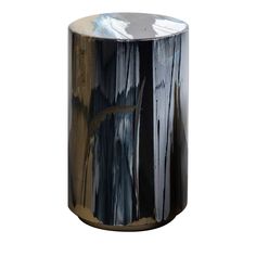 a black and gold vase sitting on top of a table