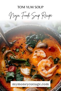 tom yum soup with shrimp and spinach in a bowl