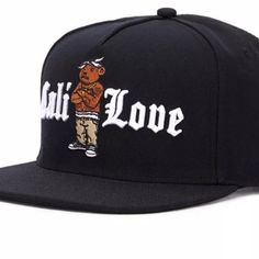 a black hat with the word'muppet love'written on it and a cartoon bear