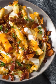 a white bowl filled with food on top of a table