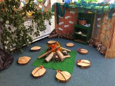 a room filled with wooden logs and decorations