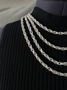 This classic sterling silver chain features an intricately engraved Prince of Wales link design and is available in 18", 20", 22" and 24" lengths. The 5.5 mm width makes this chain on the larger side and the links are hollow which makes it lightweight and comfortable to wear all day. Crafted with quality stamped 925 sterling silver, this chain will provide a luxurious finish to any ensemble. DIMENSIONS: Length: 18 Inches Width: 5.5 mm Weight: 13.8 grams Length: 20 Inches Width: 5.5 mm Weight: 14 Silver Oval Link Chain Necklace With Engraving, Silver Oval Link Engraved Chain Necklace, Link Design, Sell Gold, Silver Engraving, Polish Silver, Prince Of Wales, Jewellery Boxes, Sterling Silver Chain