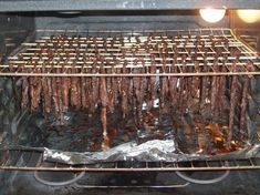 some meat is cooking on an outdoor grill