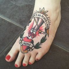 a person's foot with a tattoo on it that says there's no place like home