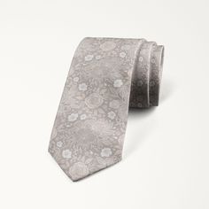 Elegant Floral Print Suit And Tie Accessories For Wedding, Elegant Floral Print Adjustable Suit And Tie Accessories, Elegant Adjustable Suit And Tie Accessories With Floral Print, Elegant Adjustable Floral Print Suit And Tie Accessories, Classic Floral Print Wedding Tie, Elegant Floral Print Suit And Tie Accessories For Groom, Formal Adjustable Floral Print Suit Accessories, Cream Standard Tie For Wedding, Wedding Suit Accessories With Floral Print Standard Tie