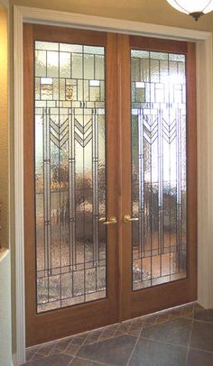 a double door with glass panels in the middle and sidelights on each side, leading to another room