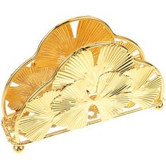 a gold brooch with fan design on it