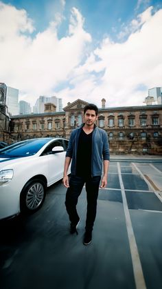 a man standing in the middle of a parking lot