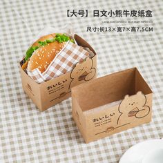 there are two boxes that have sandwiches in them