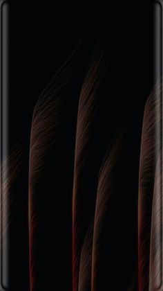 the back side of a cell phone with red feathers on it's display screen