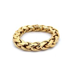 Woven Wheat Chain Bracelet in 18k Yellow Gold Crafted from radiant 18 karat yellow gold, this bracelet features a unique giant wheat chain design that will add sophistication to any look. The high polished yellow gold exudes a luminous shine, making this piece truly eye-catching. While there is a slight denting present, it only adds to the character and individuality of this one-of-a-kind bracelet. With a double safety clasp, you can wear this bracelet with confidence and ease. Elevate any look with this modern and stylish bracelet, perfect for any occasion. CHARACTERISTICS Measurements: 7.75 inches in length x .50 inches wide Era: Modern Composition: 18 Karat Yellow Gold Total Gram Weight: 46.4 g Inscription: 750 -- ALL PIECES ARE SUBJECT TO PRIOR SALE DUE TO HAVING A RETAIL LOCATION. -- Platinum Rose Gold, Sapphire Solitaire, Stylish Bracelet, Chain Design, Shop Engagement Rings, Chain Link Bracelet, Wedding Men, Chain Bracelet, Shop Earrings