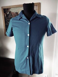 Plain Blue Button Front Golf / Polo Shirt with Wide Collar Good used vintage condition with some wear due to use and age such as pilling and a few picks. The tag says: Size 14 100% Polyester Measurements are approximately: Bust: 36" Length down middle back: 24.5" Vintage Blue Polyester Button Shirt with Collar Size Small 36 Inch Chest Red Ballet Shoes, Shirt With Collar, 80s Shirts, Plain Blue, Hat Patterns To Sew, Seventies Fashion, Button Shirt, Blue Shirt, Cute Tops