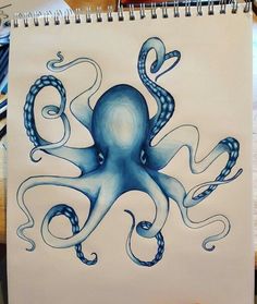 an octopus drawing is shown on a notepad