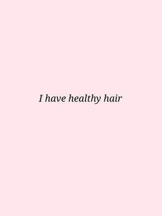 the words i have healthy hair against a pink background