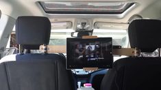 there is a tv in the back seat of a car