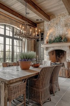 French country style dining room with stone fireplace rustic beams and dining room design French country elements 18th Century Dining Room, Weathered Oak Table, French Country Dining Room Ideas, French Country Dining Room Chairs, English Country Dining Room, Old World Dining Room, French Country Dining Room Table, French Country Dining Rooms, Dining Room Mirror Wall