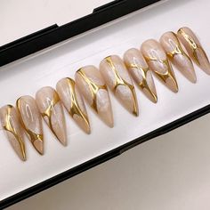 ***IMPORTANT: Please be aware of handmade set process time (read FAQ) as it's all 100% Handmade and make sure your nail size is correct as we are not responsible if the wrong size is ordered*** Enhance your nail style with our radiant cateye base and gold chrome Swirl press-on nail set. These nails exude timeless beauty, blending a classic nude foundation with intricate gold chrome swirl patterns. Shown Image: Long Stiletto & Almond Each set contains 10 false earthy tone nails (see attached size Chrome And Gold Nails, Nude Velvet Nails, Vintage Fall Nails, Gold Accent Acrylic Nails, Nail Art For September, Extravagant Birthday Nails, Birthday Nails Champagne, Milky Gold Nails, Winter Boho Nails