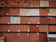 many different types of bricks are stacked on top of each other in the same pattern