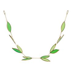 a necklace with green leaves on it