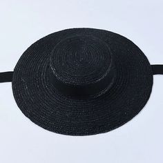 Complete your summer look with our Wide Brim Straw Boater Hat, a timeless accessory for sunny days. Crafted from straw, this boater hat features a wide brim that offers stylish sun protection. Perfect for beach outings or picnics, its classic design adds a touch of vintage charm to any outfit. Casual Straw Hat, Straw Boater Hat, Straw Boater, Black And White Ribbon, Floppy Sun Hats, Wide Brim Sun Hat, Boater Hat, نظارات شمسية, Kentucky Derby Hat