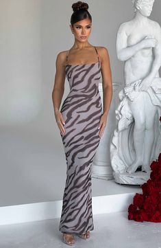 Nessa is our bold zebra printed maxi, made in softly sculpting premium mesh with stretch for your comfort. It hugs your curves with a super flattering cut, thin straps and a low back with cross straps and a tie fastening. 



Colour: Zebra Print.

Premium soft stretch mesh.

Doubled layered fabric.

Cross back straps.

Low back detail.

Hugs your figure.

Maxi length.

Model is an XS and is wearing an XS.

 Size: XS, S, M, L, XL, XXL Zebra Prom Dress, Homecoming Dresses Corset, Mesh Dresses, Midi Dress Wedding Guest, Fabric Cross, Layered Fabric, Zebra Dress, Island 2, Elegant Outfits