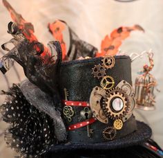 🎩Her name is "Bernice & Birdie" Small Black Top Hat on a Headband, adorned with gears, a small "caged mechanical bird" a colored broach with key, ribbon, colorful gems, feathers &  toole  My Punkadelic Headbands are One of a kind Frilly, Feathery, Fancy, Flowy & Funtastic and is sure to Punky up your Funky as you Gear up for any Event or Party!  ⚙️Every Punkadelic Item is One-Of-A-Kind, Handcrafted, Unique & Eclectic. Each Imperfectly Perfect Creations is Made with ❤️ &  My 🤲🏻.   🗝Please feel free to message me with any questions, for additional pictures of this item or If you are interested in a custom created commission top hat or headpiece. 💡Thank You for Peepin' my Punktastic pieces! Have a Technicolored Today 🤩 🧭 Fast and free shipping to the continental U.S. Adjustable Vintage Costume Hats And Headpieces As Gifts, Adjustable Vintage Top Hat As A Gift, Vintage Handmade Costume Hats And Headpieces For Gifting, Handmade Adjustable Steampunk Costume Hats And Headpieces, Vintage Black Mini Hats For Themed Events, Mechanical Bird, Punk Top, Casino Costumes, Steampunk Top