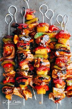 several skewers filled with meat and vegetables