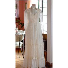 INCREDIBLE 1970s Gunne Sax Bridal Collection wedding dress. A little western prairie, a little etherial Victorian. Ivory off white.  Maxi prairie dress style, with a lace-up bodice and pearl-beaded high collar. Long, sheer lace sleeves with pearl buttons on cuffs.  Hidden zipper closure on the back and tie at the waist.  EXCELLENT vintage condition. It is not brand new, so don't expect absolute perfection, but darn if it isn't close! I did not find any visible flaws.  Fits like a size small (labeled a size 7). PERFECT fit on the mannequin, which has a 32" bust, 25.5" waist, 34" hips. If you need dress measurements, please ask.  Price includes shipping. :)  **ALL vintage items will have SOME minor signs of age and wear. This item is in overall excellent condition, and I have done my best to 1970s Fitted Vintage Wedding Dress, 1970s Fitted Wedding Dress, 1970s Style Fitted Wedding Dress, Vintage Maxi Wedding Dress, Vintage Fitted Maxi Dress For Wedding, Vintage Style Fitted Maxi Dress For Wedding, Vintage Lace Maxi Dress For Wedding, Vintage Wedding Maxi Dress, Retro Maxi Dress For Wedding