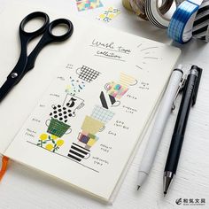 an open notebook with scissors, tape and other crafting supplies on top of it