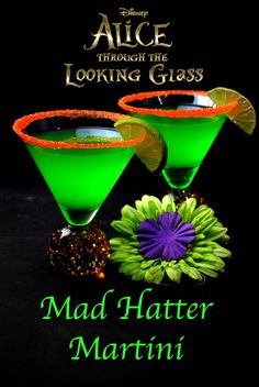 two green martinis sitting next to each other on top of a black background with the words alice through the looking glass