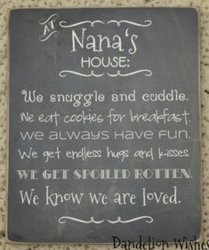 a chalkboard sign that says, nana's house we sanggle and cuddle