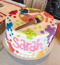 a decorated cake sitting on top of a table