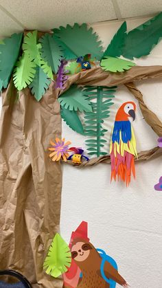 a paper bag hanging from the side of a tree with birds and leaves on it