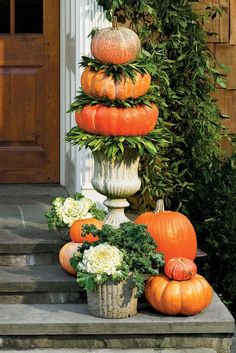 a bunch of pumpkins that are sitting on some steps