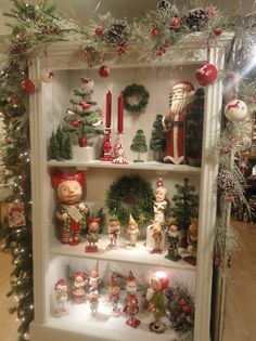 a shelf filled with lots of christmas decorations