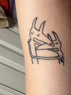 a tattoo on the leg of a person with a deer head and antelope