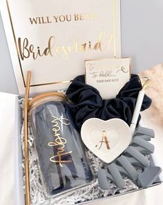 the bridesmaid gift set includes a heart shaped bottle, bow tie and other accessories