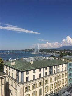 an aerial view of a building with water spouting from the roof